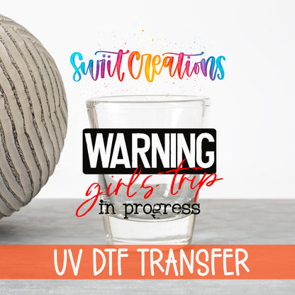 Warning Girls Trip in Progress UV DTF transfer on a clear shot glass with the Swiit Creations logo and UV DTF Transfer banner