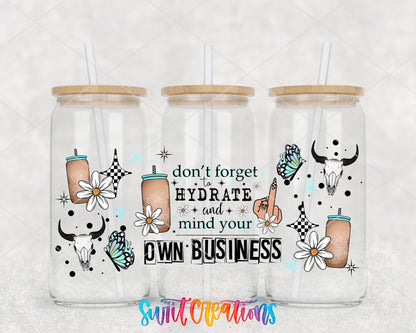 Don't Forget to Hydrate and Mind Your Own Business UV DTF wrap on three glass cans