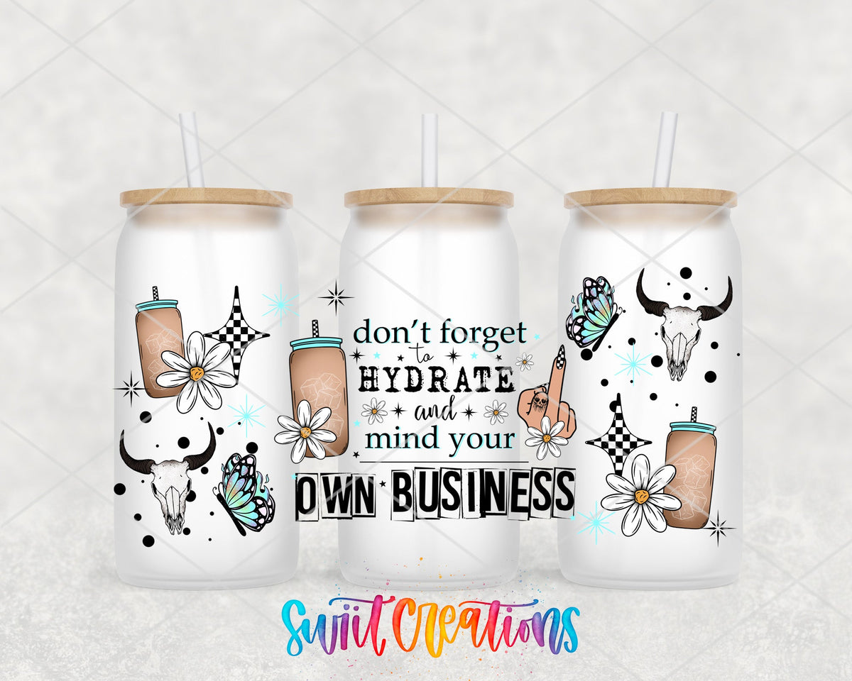 Don't Forget to Hydrate and Mind Your Own Business UV DTF wrap on three frosted glass cans