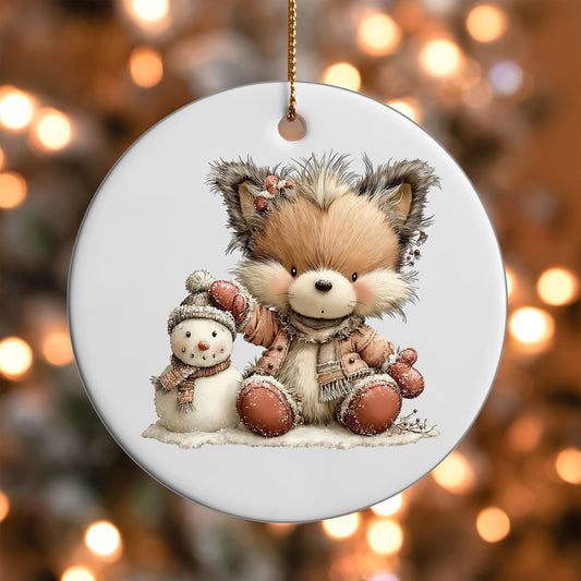 Winter Fox and Snowman ornament UV DTF transfer on a round white ornament with a bokeh light background