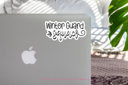 Winter Guard Squad sticker on the lid of a silver laptop