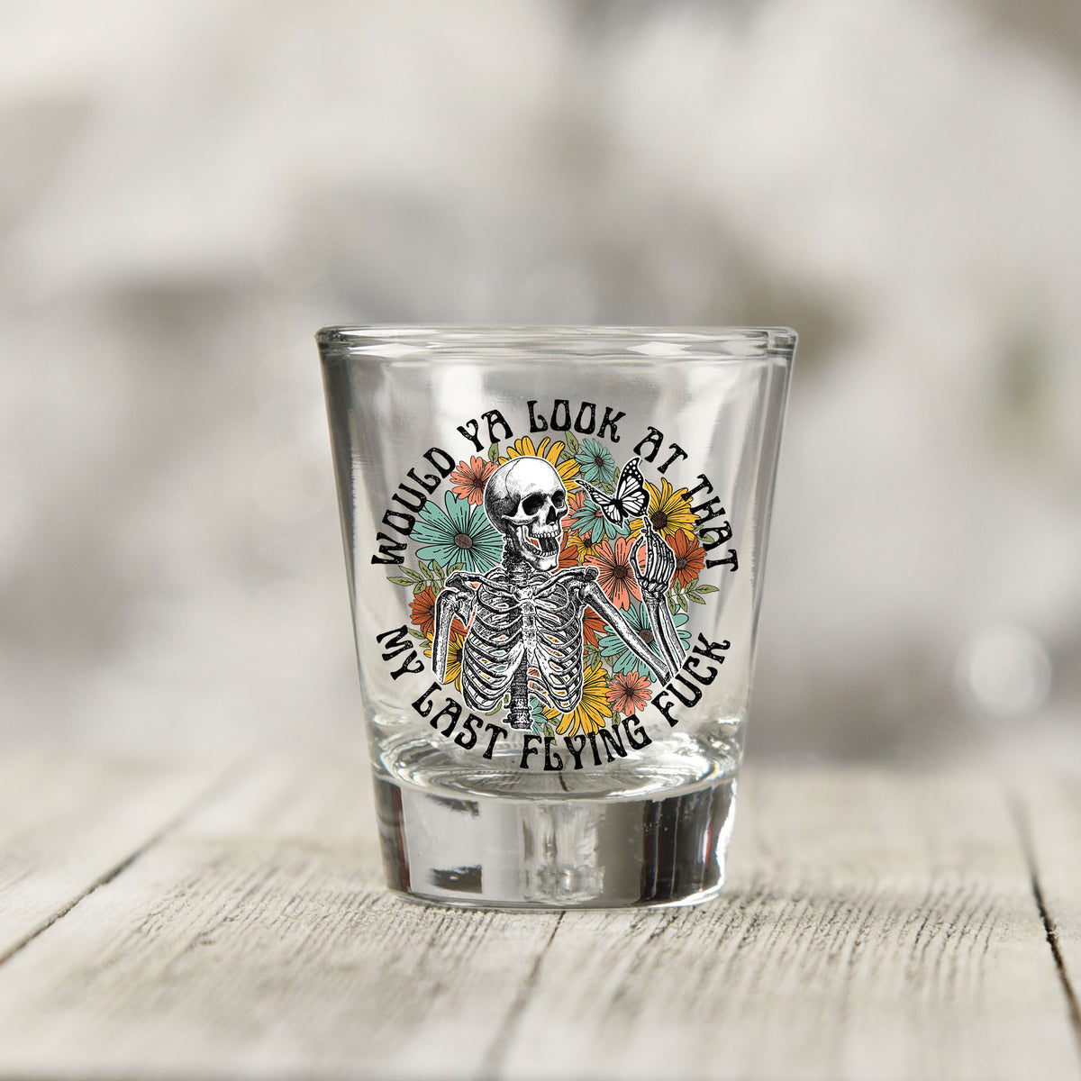 Close-up of the Would You Look At That My Last Flying F*ck UV DTF transfer on a clear shot glass