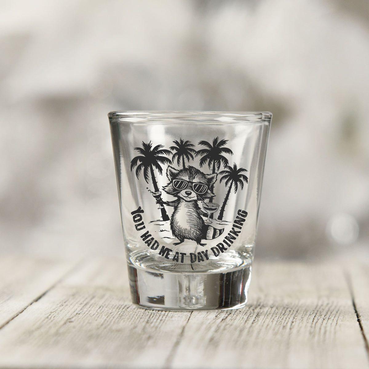 Close-up of the You Had Me at Day Drinking UV DTF transfer on a clear shot glass