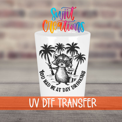 You Had Me at Day Drinking UV DTF transfer on a white shot glass in front of a brick wall