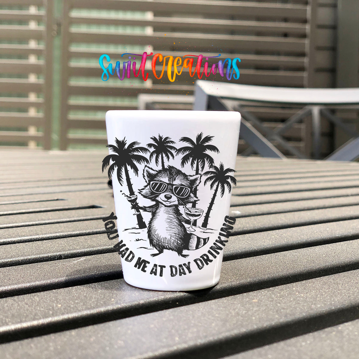 You Had Me at Day Drinking UV DTF transfer on a white shot glass on an outdoor patio table