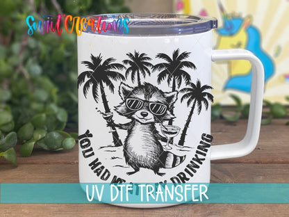 You Had Me at Day Drinking raccoon in sunglasses UV DTF transfer on a white stainless steel mug with a lid