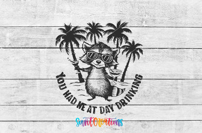 You Had Me at Day Drinking raccoon in sunglasses UV DTF transfer artwork on a white wood background