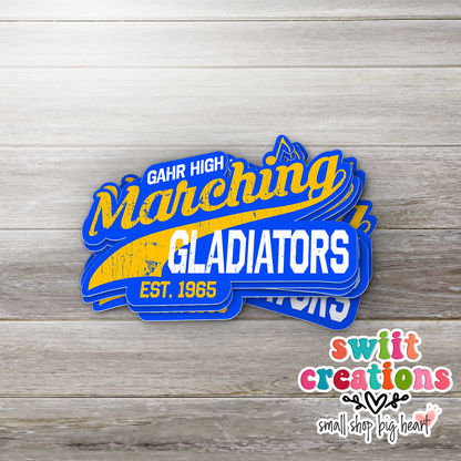 Gahr High Marching Gladiators stickers stacked on gray wood with the Swiit Creations logo