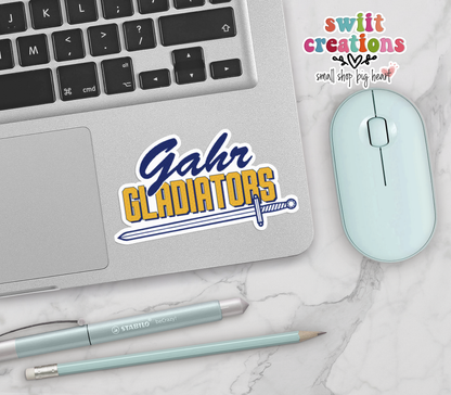 Gahr Gladiators vinyl sticker on a silver laptop next to a mint mouse and pens