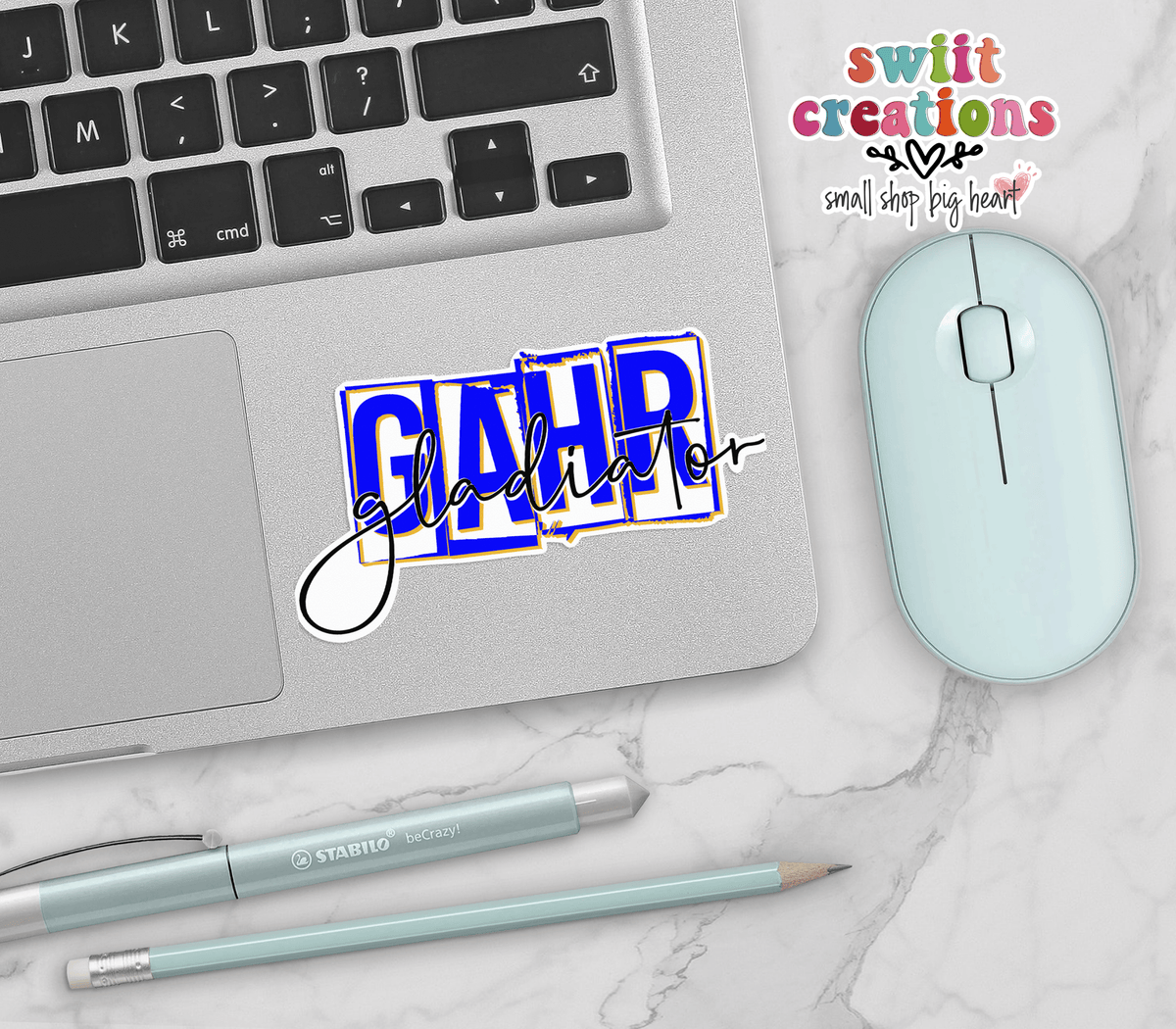 Gahr Gladiators Blue Script vinyl sticker on a silver laptop next to a mint mouse and pens